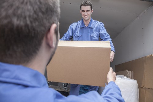 Moving boxes and furniture during Saint Pancras removals in central London