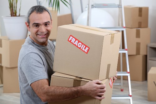 Moving boxes being loaded into a removal van in Saintpancras