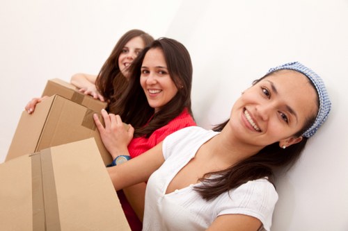 Professional movers packing and labeling boxes for Saintpancras relocation